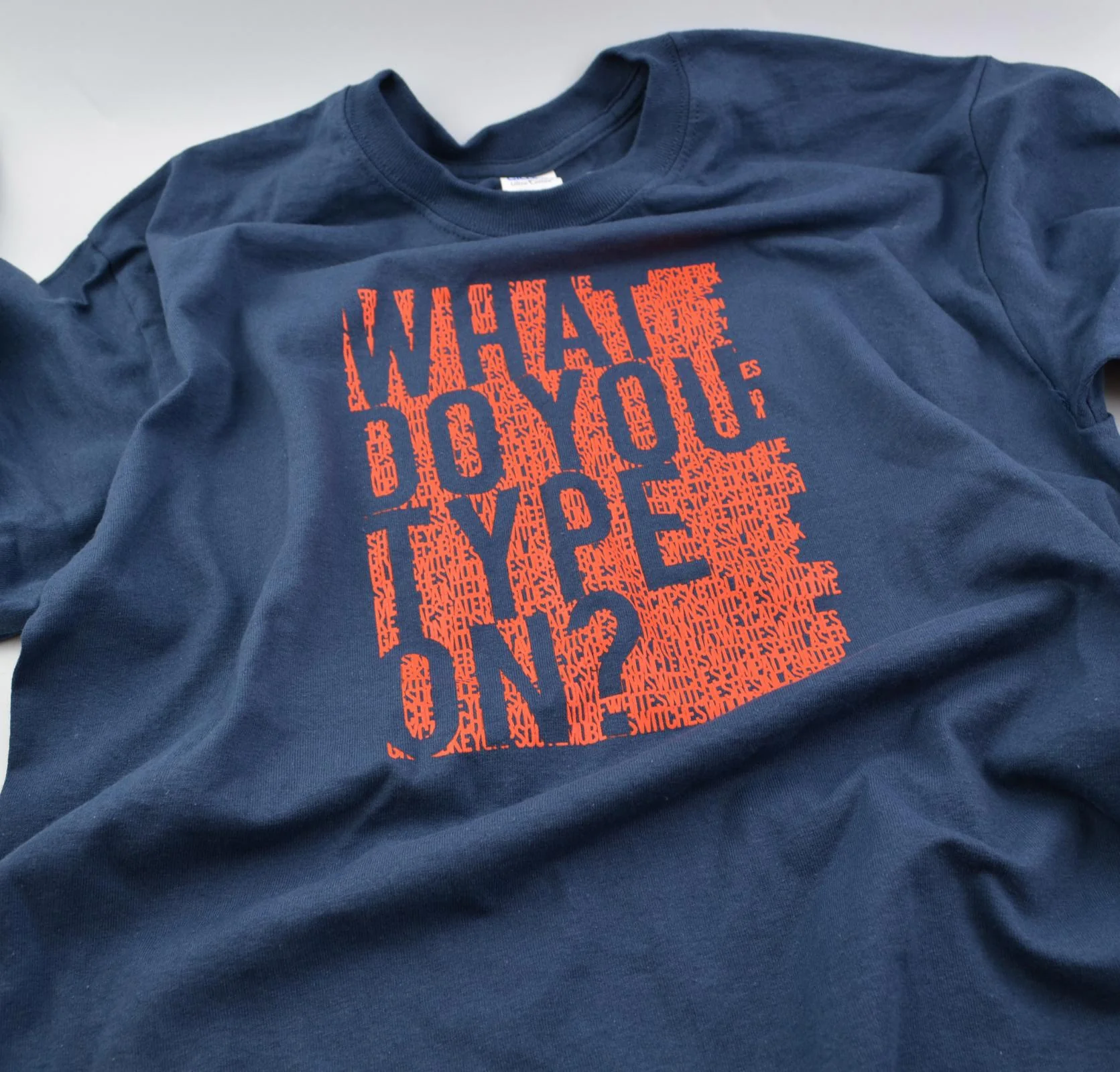 MK What do you type on? Navy T-Shirt